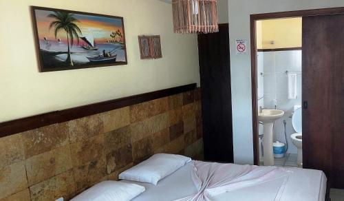 Giường trong phòng chung tại Bella Natal Praia Hotel