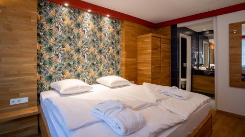 
Ein Bett oder Betten in einem Zimmer der Unterkunft Hotel Koener
