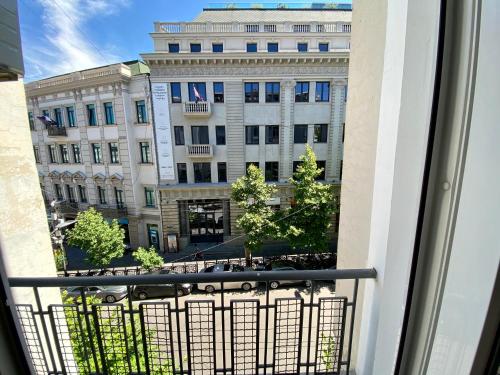 a view of a building from a balcony at Liberty Apartment in Tbilisi City