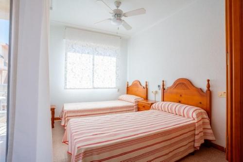 Katil atau katil-katil dalam bilik di Apartamento CA VALEN 4