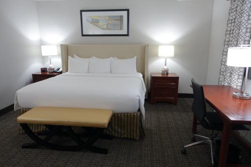 a hotel room with a large bed and a desk and a desk at State Plaza Hotel in Washington