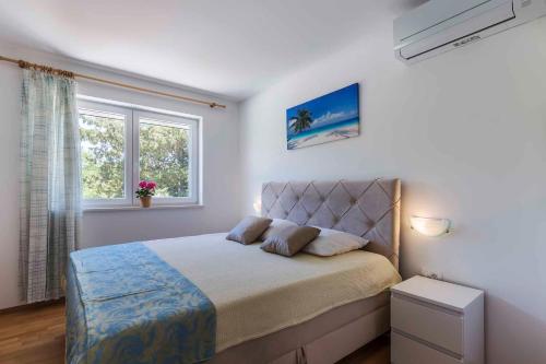 Postel nebo postele na pokoji v ubytování Holiday home in Labin/Istrien 8880