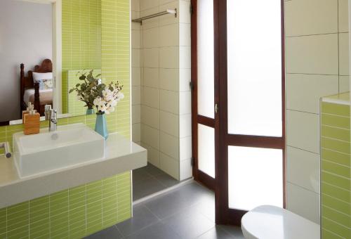 a bathroom with a sink and a mirror at Apartments in Albufeira - Old Town in Albufeira