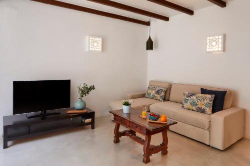 a living room with a couch and a coffee table at Apartments in Albufeira - Old Town in Albufeira