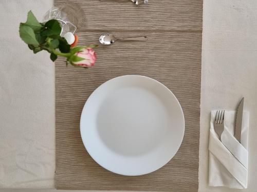 a white plate sitting on top of a table at Villa Vittoria in Mesagne