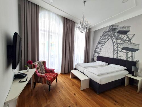 a bedroom with two beds and a desk and a chair at Room 55 in Vienna