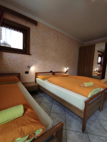 Voodi või voodid majutusasutuse Baita Stella Alpina toas