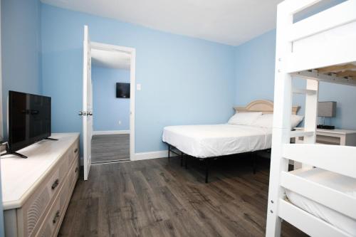 Ένα ή περισσότερα κρεβάτια σε δωμάτιο στο Garfield Beach House