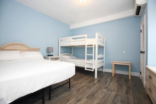 Ένα ή περισσότερα κρεβάτια σε δωμάτιο στο Garfield Beach House