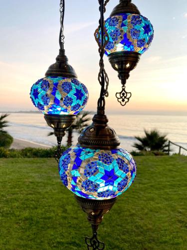 two stained glass lights hanging from a chain at Puerto Velero Primera Línea Primer Piso al lado de la Playa! 8pax in Puerto Velero