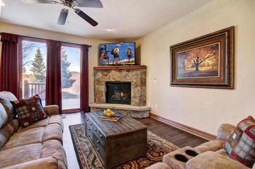 a living room with a couch and a fireplace at Highland Greens 93 Apartment in Breckenridge