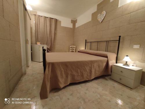 Ένα ή περισσότερα κρεβάτια σε δωμάτιο στο Masseria Don Egidio