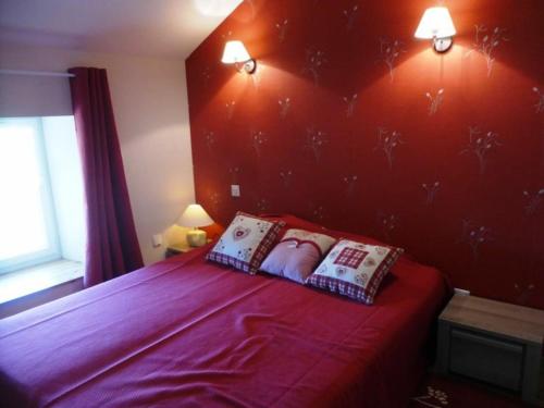 a bedroom with a bed with two pillows on it at Gîte Freycenet-la-Cuche, 3 pièces, 4 personnes - FR-1-582-26 in Freycenet-la-Cuche