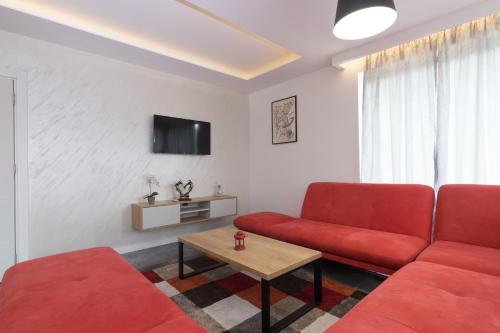 Televisyen dan/atau pusat hiburan di Deluxe Feliciano Apartments