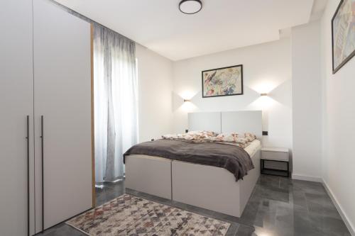Katil atau katil-katil dalam bilik di Deluxe Feliciano Apartments