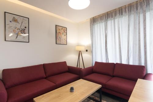 Ruang duduk di Deluxe Feliciano Apartments