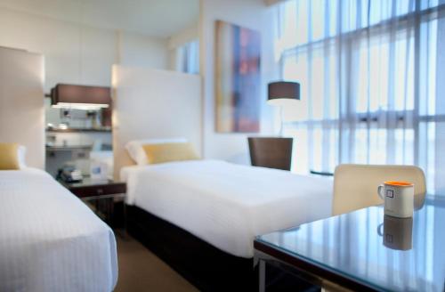  Centro Capital Centre By Rotana -  Room  picture :   Shower    Safety deposit box    TV                           