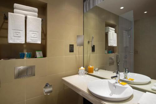  Centro Capital Centre By Rotana -  Room  picture :   Shower    Safety deposit box    TV                           