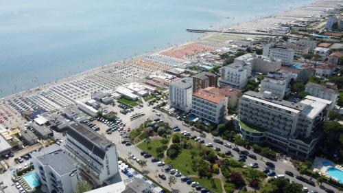 an aerial view of a city with a beach and buildings at Golf & Beach Hotel B&B in Milano Marittima