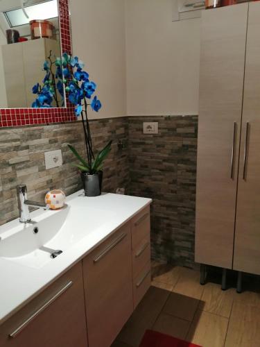 a bathroom with a sink and a mirror at La Casetta di Baveno in Baveno