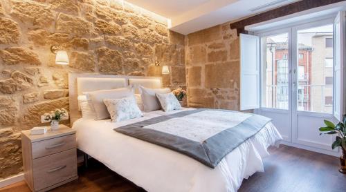 Postel nebo postele na pokoji v ubytování Apartamentos Turísticos de La Vega