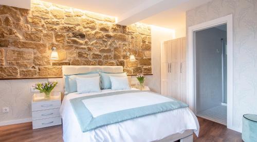 Postel nebo postele na pokoji v ubytování Apartamentos Turísticos de La Vega