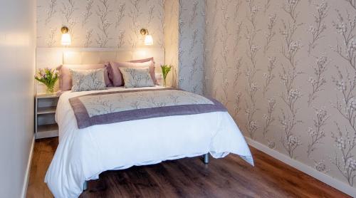 Postel nebo postele na pokoji v ubytování Apartamentos Turísticos de La Vega