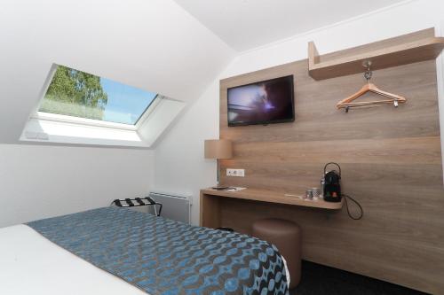 En eller flere senge i et værelse på Sure Hotel by Best Western Limoges Sud