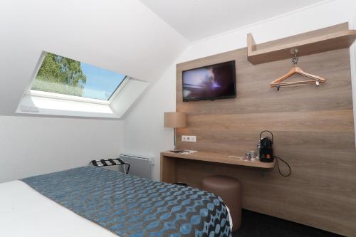 TV a/nebo společenská místnost v ubytování Sure Hotel by Best Western Limoges Sud