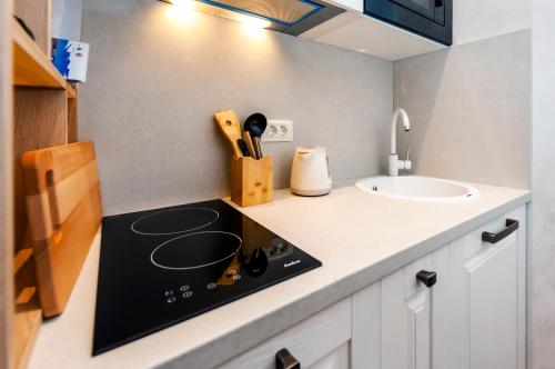a kitchen with a counter top with a sink at Ground Floor Gem (city centre) in Rovinj