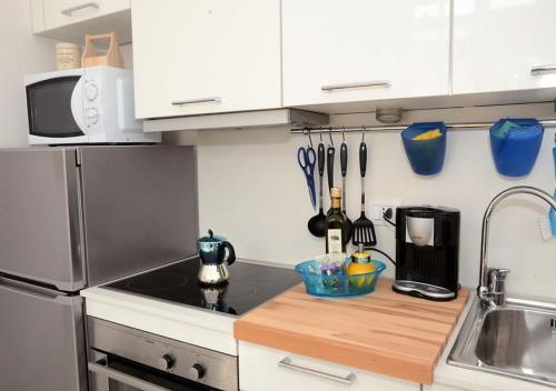 A kitchen or kitchenette at Michelangelo al Duomo - Bufalini Apartments