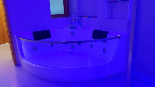 a purple bathroom with a tub and a sink at Amanda's Dream in Taranto