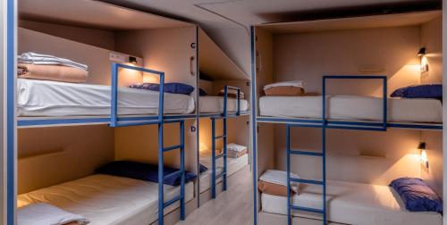 two sets of bunk beds in a room at Santiago KM-0 in Santiago de Compostela