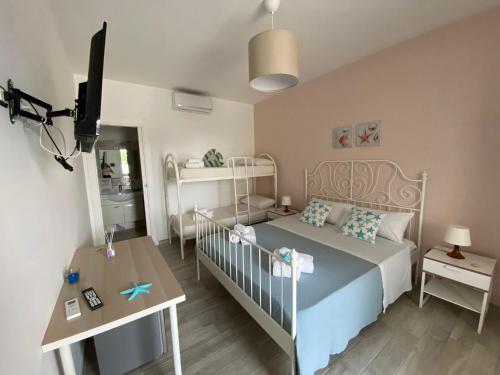 Postel nebo postele na pokoji v ubytování Residence La Perla Marzamemi