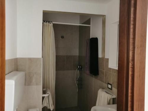 a bathroom with a shower and a toilet and a sink at il Pascià Affittacamere in Otranto