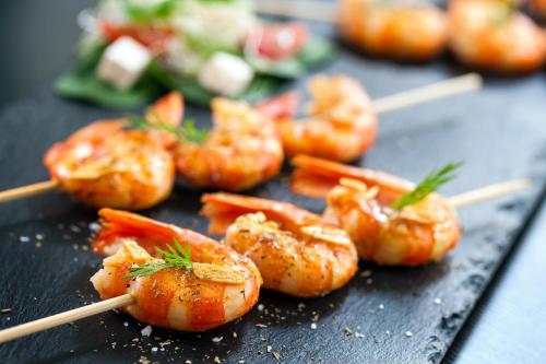 a group of shrimp on skewers on a table at Wohlfühlhotel Innertalerhof in Gerlos