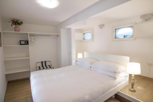 Postel nebo postele na pokoji v ubytování Masanto Mini Apartment