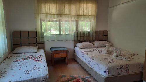Postel nebo postele na pokoji v ubytování Teo Hotel&Pansion
