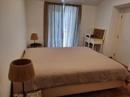 Postel nebo postele na pokoji v ubytování À Espera no Monte