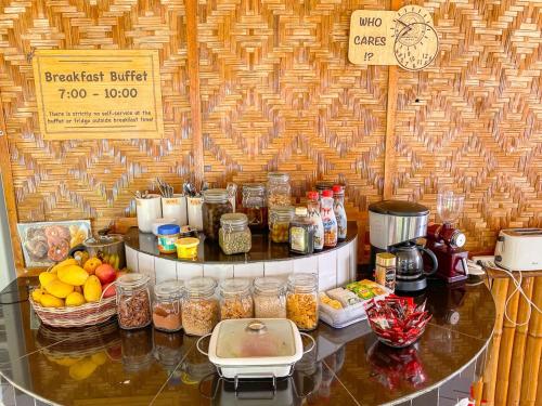 a counter with various food items on top of it at Parrot Resort Moalboal in Moalboal
