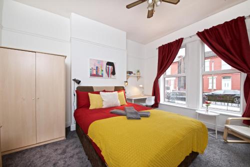 a bedroom with a yellow bed and a window at Liverpool City Stays - Economy Room Close to city centre GG in Liverpool