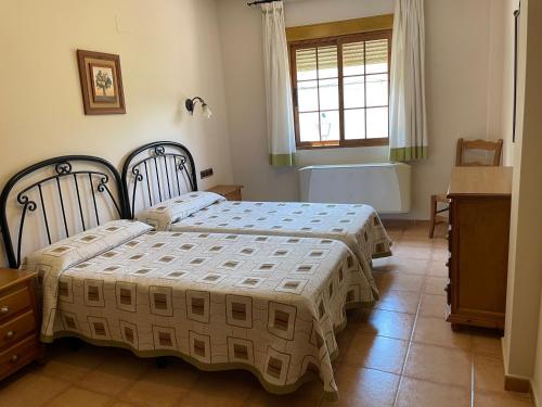Ένα ή περισσότερα κρεβάτια σε δωμάτιο στο Apartamentos Margarita