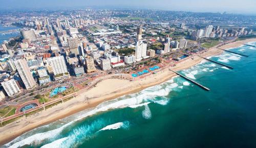 an aerial view of a beach and the ocean at Bayside Hotel & Self Catering 110 West Street in Durban
