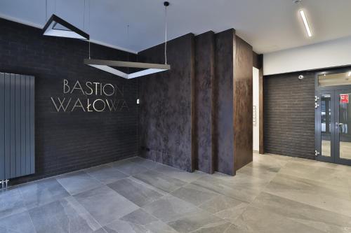 a lobby with a large sign on the wall at Gdansk Old Town Walowa Apartments by Renters in Gdańsk