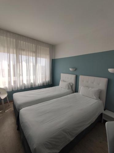 Ein Bett oder Betten in einem Zimmer der Unterkunft Abrivado