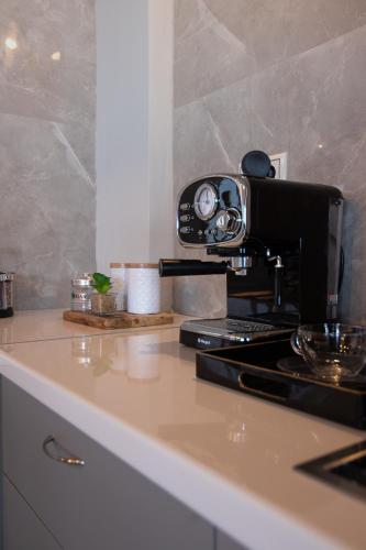 a camera sitting on top of a kitchen counter at Georgianna's suite with private pool , 'greysuite' in Kómpoi