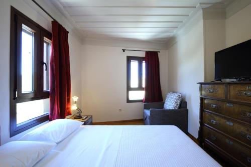 Postel nebo postele na pokoji v ubytování Stafilos House