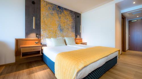 Ein Bett oder Betten in einem Zimmer der Unterkunft Hotel Ifinger
