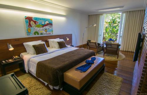 Llit o llits en una habitació de Garden Hill Hotel e Golfe