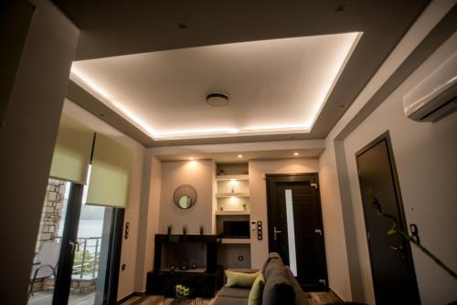 a ceiling in a living room with a couch at Paraiso Azul Villas in Áyios Dhimítrios